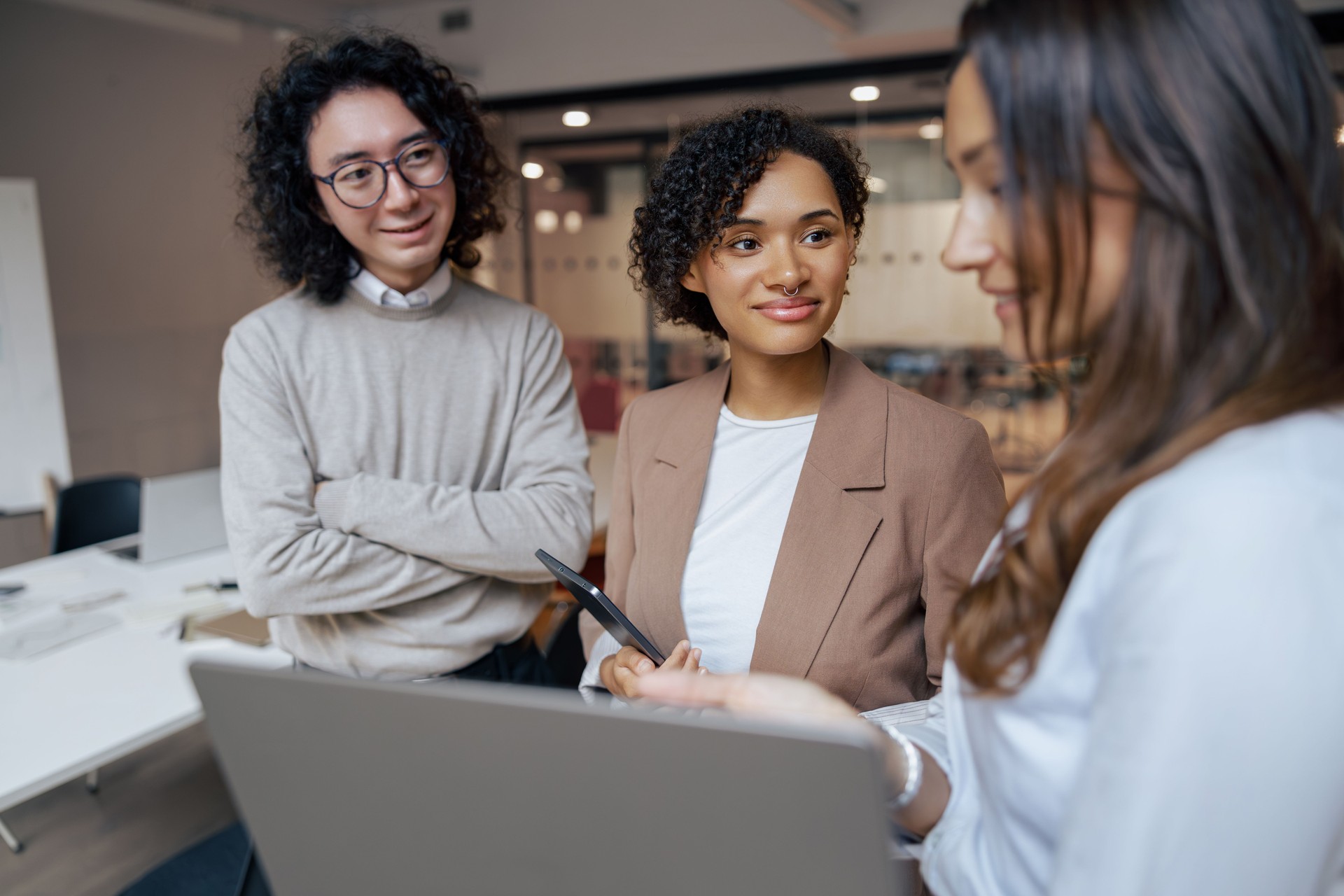 Engaging in a Collaborative Business Meeting with Colleagues in a Modern Office Space